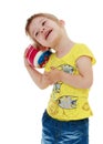 Little girl hugging the ball. Royalty Free Stock Photo