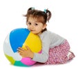 Little girl hugging a big ball Royalty Free Stock Photo