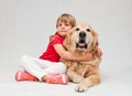 Little girl hugging big golden retriever dog Royalty Free Stock Photo
