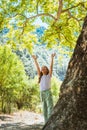 Little girl hugging big tree Royalty Free Stock Photo