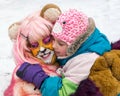 Little girl hugging female clown in animal disguise