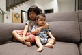 Adorable asian siblings being playful at their home stock photo