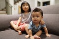Adorable asian siblings being playful at their home stock photo