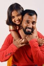 Little girl hugging her father and on his shoulders. Pune, Maharashtra Royalty Free Stock Photo