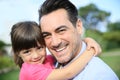 Little girl hugging her smiling father Royalty Free Stock Photo