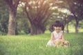 little girl hugging her teddy bear in park. Royalty Free Stock Photo