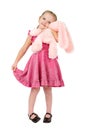 Little girl hugging a pink toy rabbit Royalty Free Stock Photo