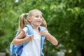 The little girl is in a hurry to study. The concept of school, study, education, friendship, childhood. Royalty Free Stock Photo