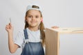 Little girl in image collector of furniture with tools