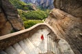 A little girl immersed in the panorama of Meteora