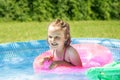 Little Girl in Inflatable Poll Royalty Free Stock Photo