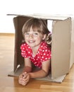 Little girl inside a cardboard box Royalty Free Stock Photo