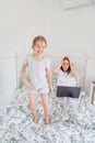 Little girl interferes to work mom at home. Royalty Free Stock Photo