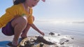 Little girl winter clamming at Pismo Beach Royalty Free Stock Photo