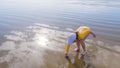 Little girl winter clamming at Pismo Beach Royalty Free Stock Photo