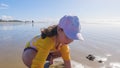 Little girl winter clamming at Pismo Beach Royalty Free Stock Photo