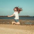 Little girl jump on a beach Royalty Free Stock Photo