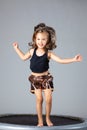 Little girl jumping in the air on a trampoline