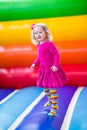 Little girl jumping and bouncing Royalty Free Stock Photo