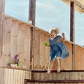 Little girl jumping on a country house stairs Royalty Free Stock Photo