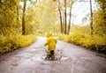 Little girl jumping fun in a dirty puddle Royalty Free Stock Photo