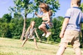 Little girl jumping high through the elastic. Royalty Free Stock Photo