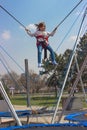 Little girl jumping on trampoline Royalty Free Stock Photo