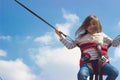 Little girl jumping on trampoline Royalty Free Stock Photo