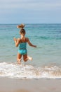 Little Girl Jumping in the Ocean Royalty Free Stock Photo