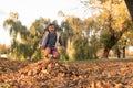 Little girl playing in the colorful autumn leaves Royalty Free Stock Photo