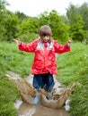 Little girl jumping in the pool Royalty Free Stock Photo