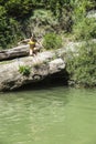 Little girl jumping in a river Royalty Free Stock Photo