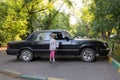 Little girl jumps to window to see sitting in the car Grandpa Royalty Free Stock Photo