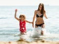 Little girl kid and woman mother in sea water. Fun Royalty Free Stock Photo