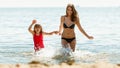 Little girl kid and woman mother in sea water. Fun Royalty Free Stock Photo