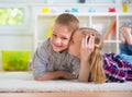 Little girl kiss her happy brother