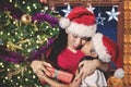 Little girl kissing her mother at Christmas time Royalty Free Stock Photo