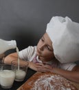 Little girl kneads dough Royalty Free Stock Photo