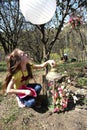 Little girl with lantern and flowers