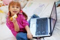 Little girl with laptop Royalty Free Stock Photo