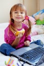 Little girl with laptop Royalty Free Stock Photo