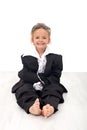 Little girl in large business clothes