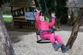 Little girl laughing while having fun on a swing. Royalty Free Stock Photo