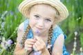 Little girl in lavender field. kids fantasy. Smiling girl sniffing flowers in summer purple lavender field