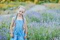 Little girl in lavender field. kids fantasy. Smiling girl sniffing flowers in summer purple lavender field Royalty Free Stock Photo