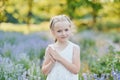 Little girl in lavender field. kids fantasy. Smiling girl sniffing flowers in summer purple lavender field Royalty Free Stock Photo