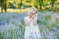 Little girl in lavender field. kids fantasy. Smiling girl sniffing flowers in summer purple lavender field Royalty Free Stock Photo