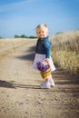 Little girl with lavender flower bouquet Royalty Free Stock Photo