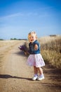 Little girl with lavender flower bouquet Royalty Free Stock Photo