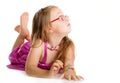 Little girl laying on floor isolated Royalty Free Stock Photo